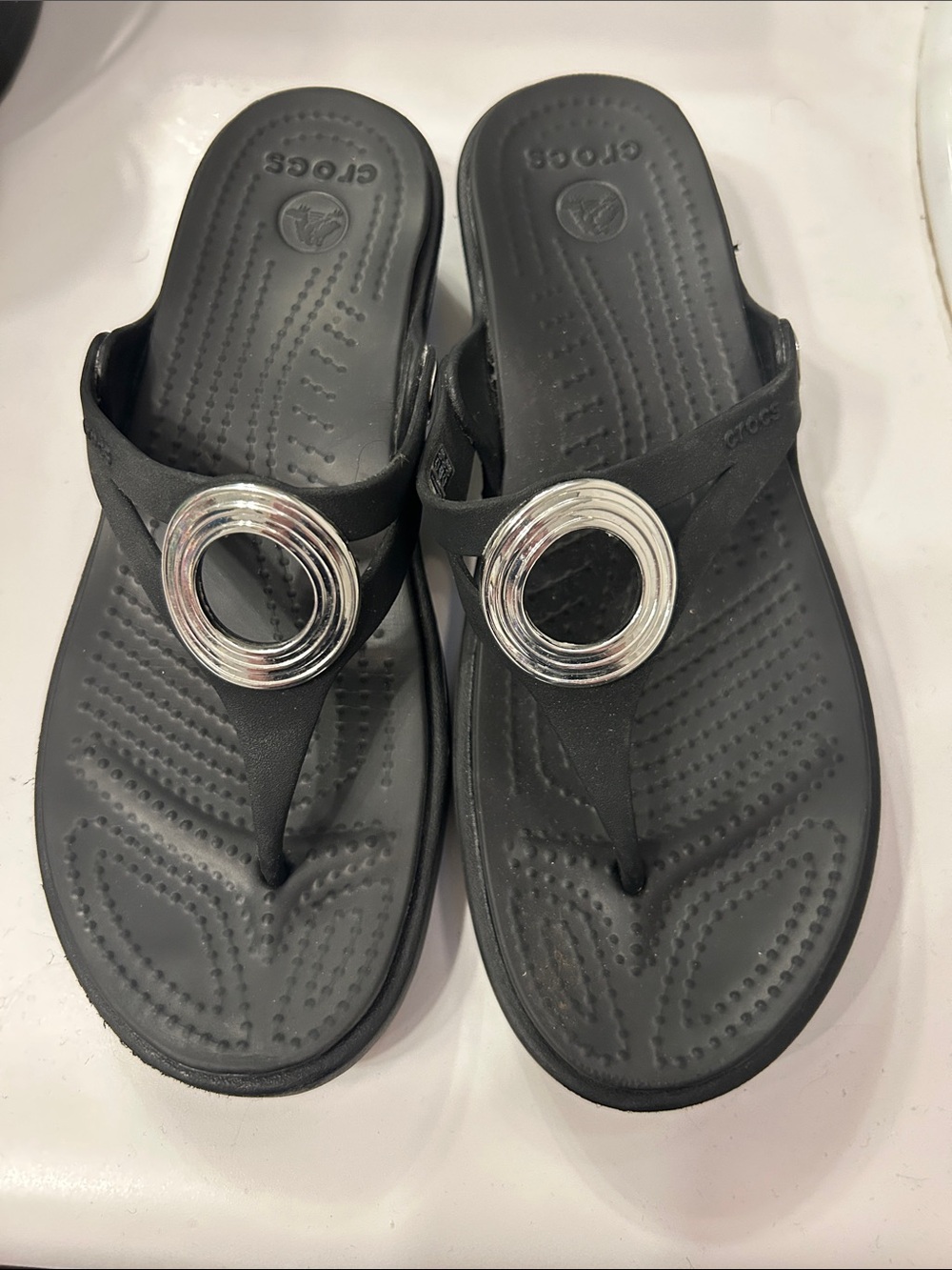 CROCS Black Thong Sandals with Silver Circle Accent
